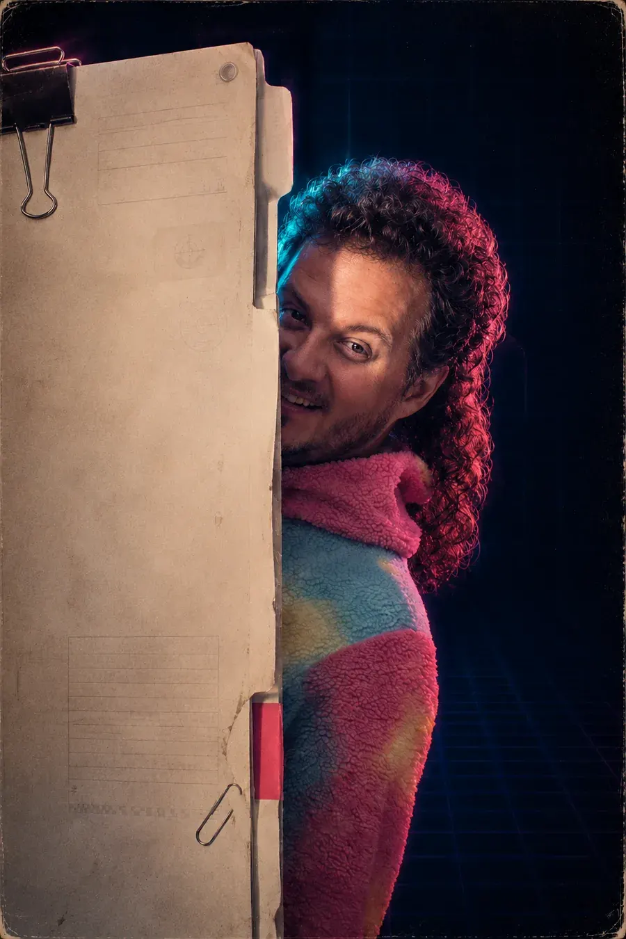 Tom Rayner peeking out from behind a retro evidence folder